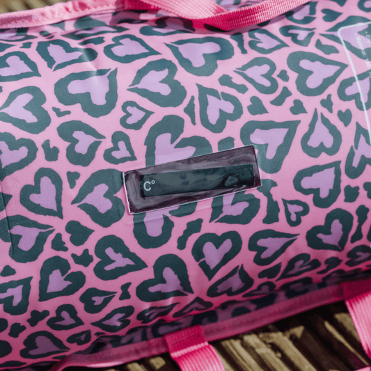 Pink inflated tow float with heart pattern and visible built in thermometer screen