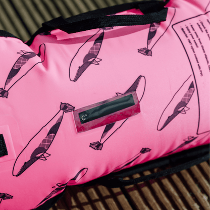 Pink tow float with black whale pattern and a digital temperature gauge.