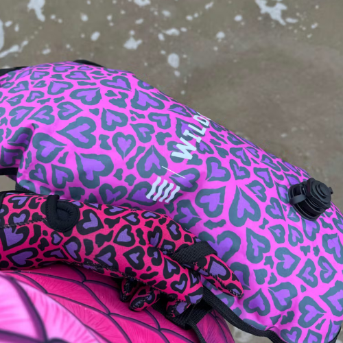 Pink and purple heart-patterned tow float in the sea