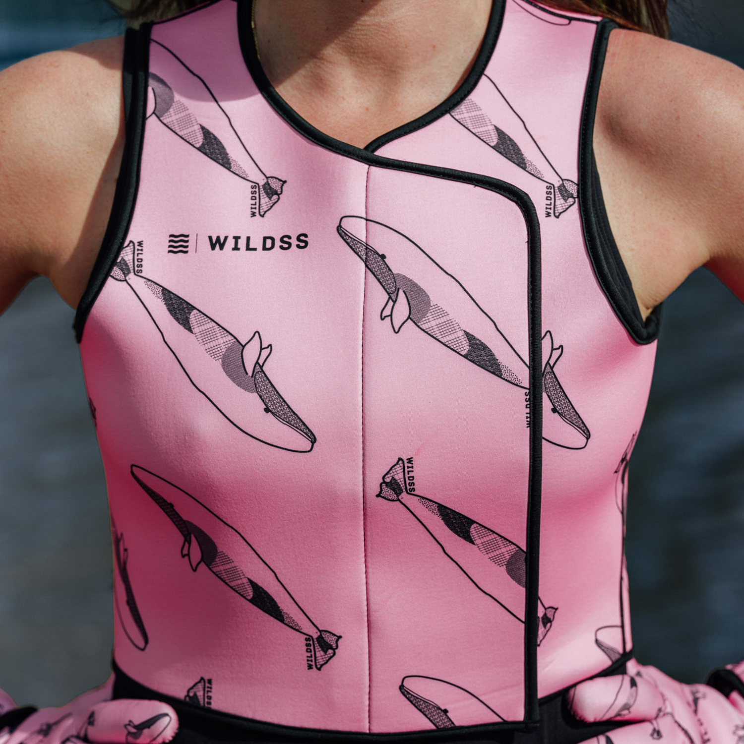 Pink neoprene body warmer with black whale pattern 