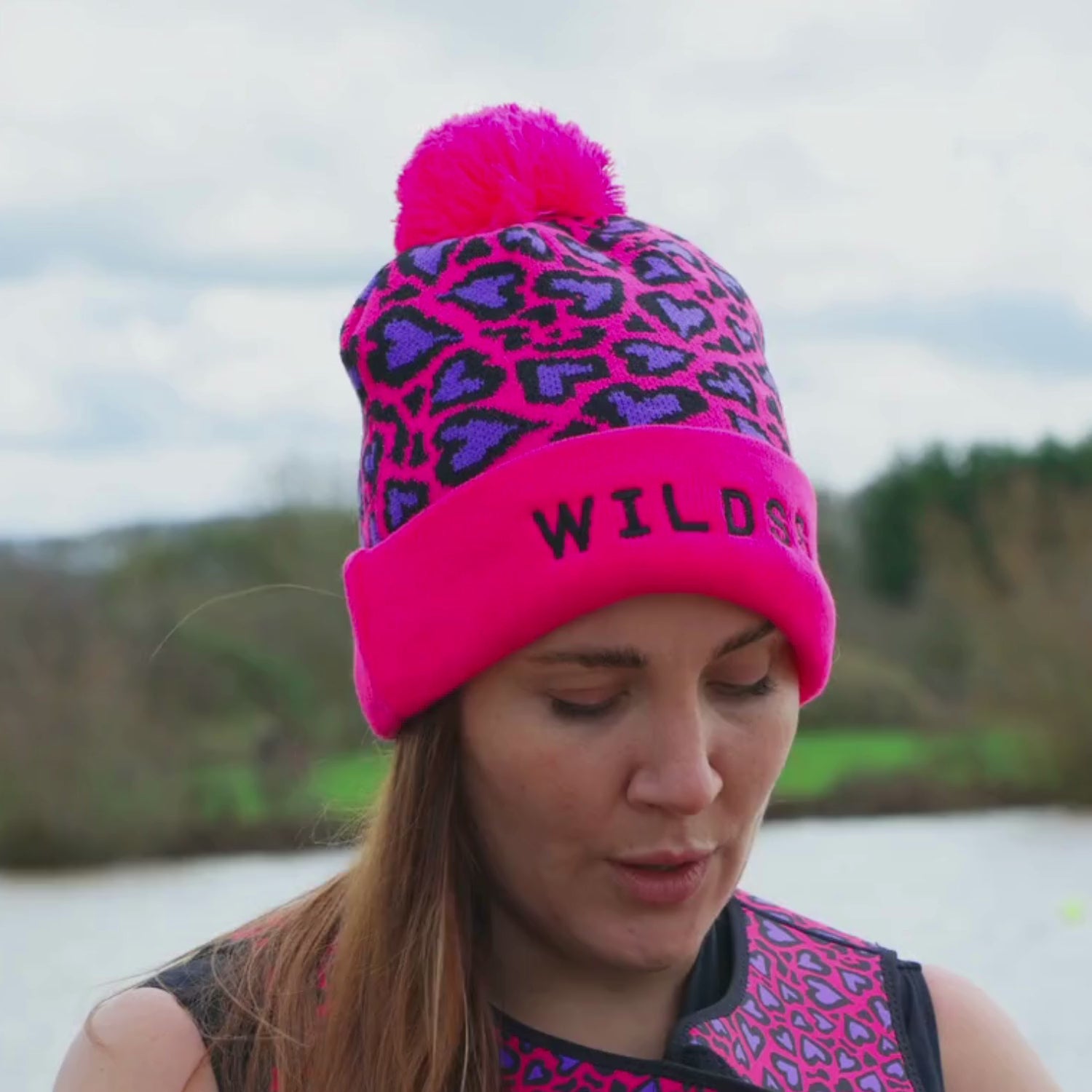 Pink leopard print woolly hat with logo on the front